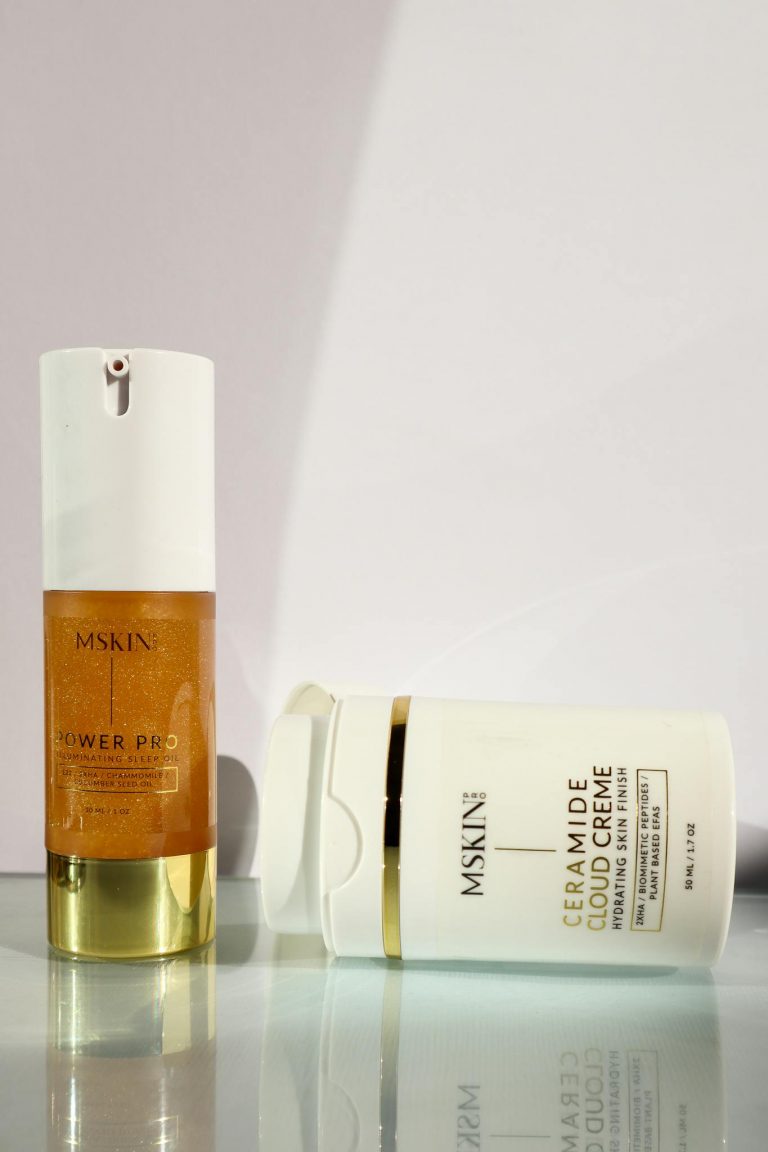 Elegant shot of luxury skincare products with sleek packaging in soft lighting.